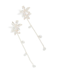 Elegantly crafted silver plated cubic zirconia flower station drop earrings featuring floral charm design front view - link has visual effect only