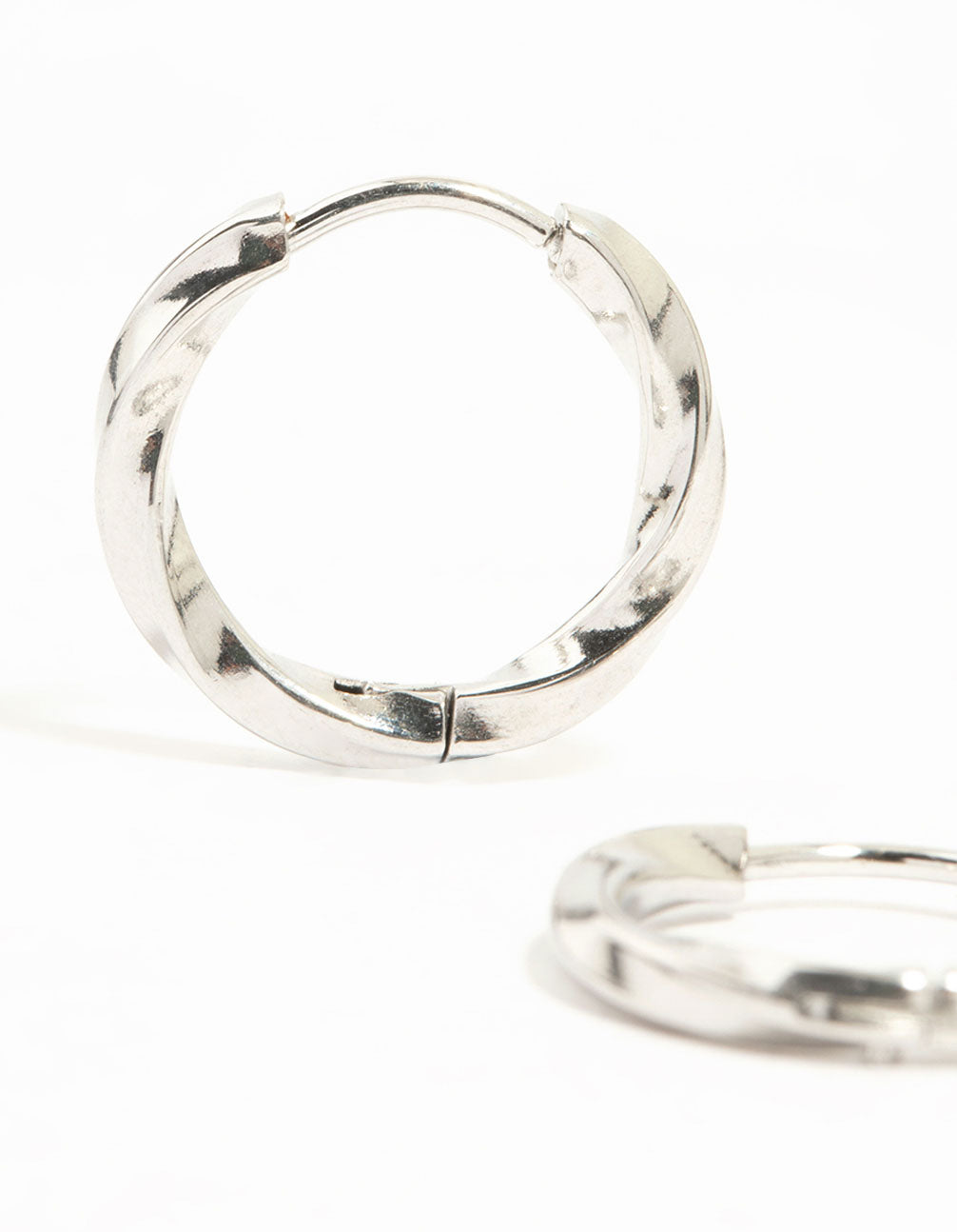 Crafted from waterproof stainless steel twisted hoop earrings in silver close up view