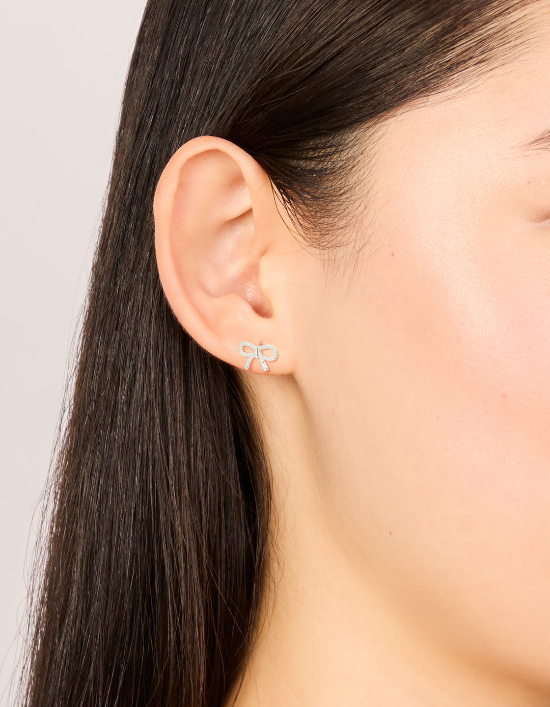Sterling Silver Textured Bow Stud Earrings