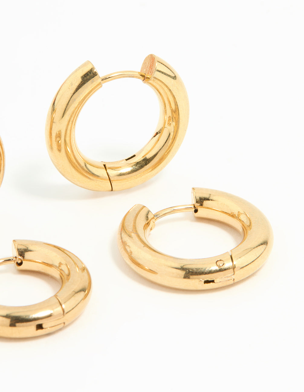 Highlighting waterproof gold plated stainless steel tube hoop earrings in a 2 pack post detail view