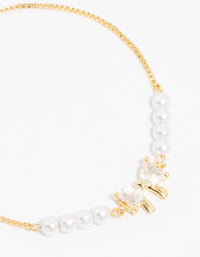 Gold Plated Cubic Zirconia Bow & Pearl Toggle Bracelet - link has visual effect only