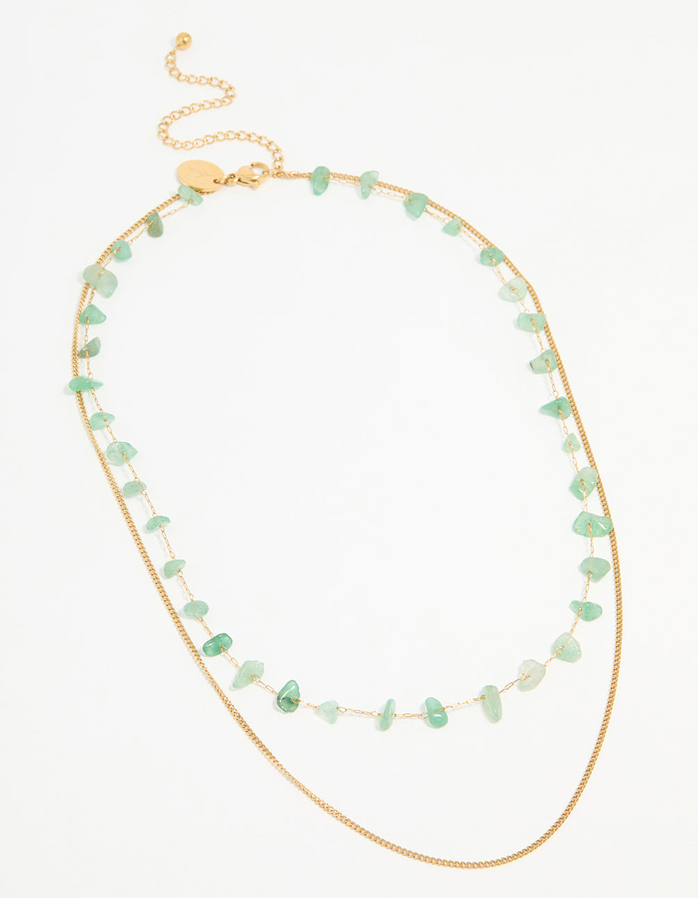 Crafted from waterproof stainless steel, this gold plated layered necklace features green stone beads accents front view