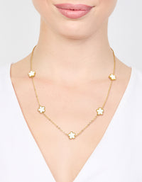 Beautifully displayed waterproof gold plated stainless steel shell petal flower pendant necklace featuring floral in dainty style on neck view - link has visual effect only