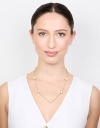 Featuring a waterproof gold plated stainless steel shell petal flower pendant necklace in floral and dainty style on model view - link has visual effect only