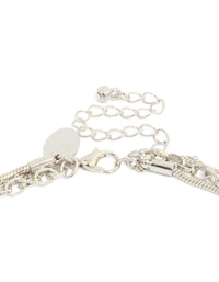Beautifully designed layered necklace with beads, cross and heart in silver clasp detail view - link has visual effect only