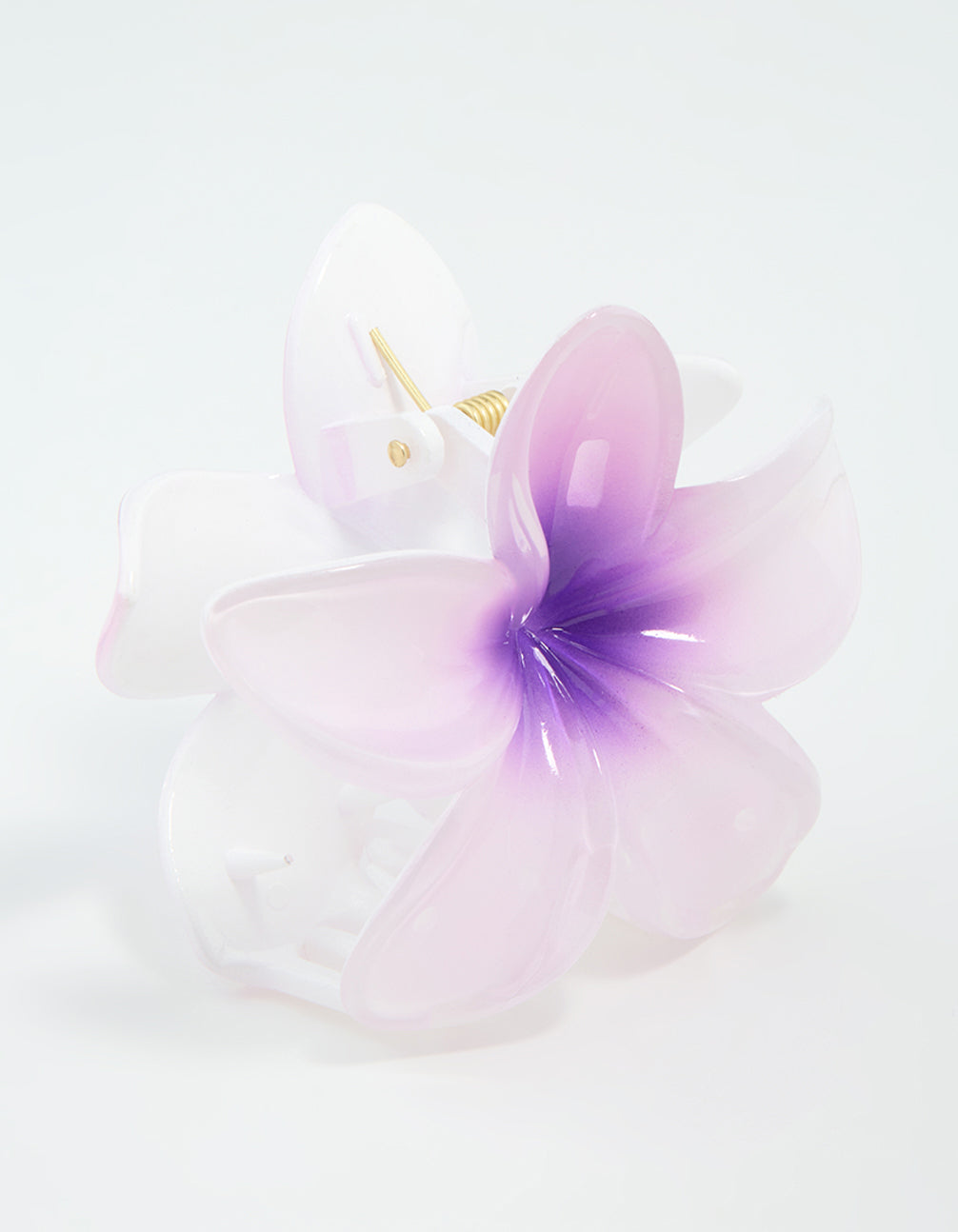 Showcasing a purple ombre pearlised frangipani claw clip in light pink and white front view