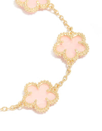 Featuring gold plated pink flowers charm bracelet with dainty style close up view - link has visual effect only
