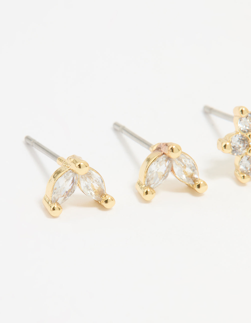 Featuring gold plated cubic zirconia flower and leaf stud earrings in a 2-pack close up view