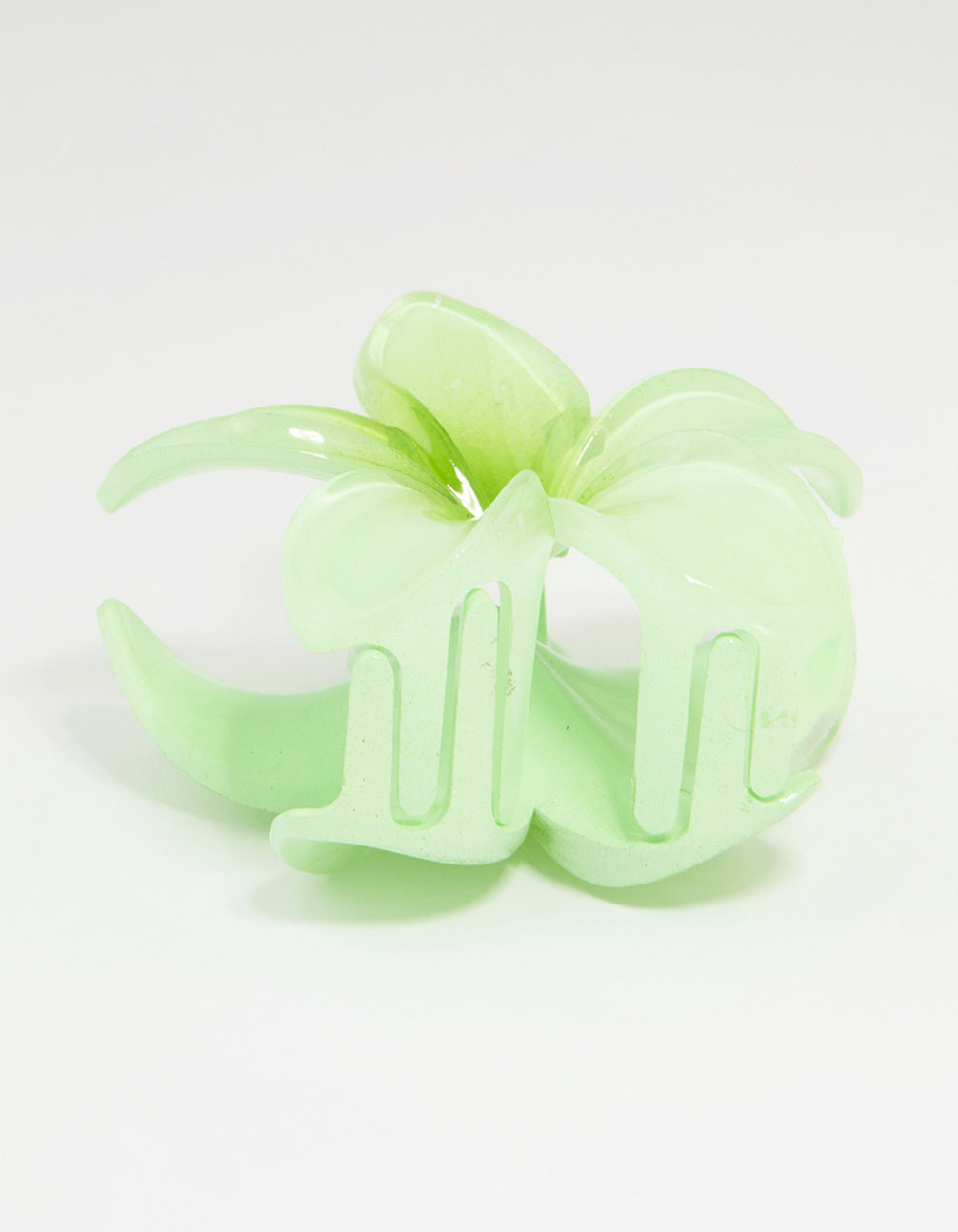 Stunning tropical claw clip in green ombre with floral design, pale and lime tones, and gold hardware side view