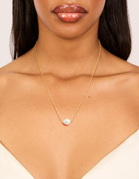 Showcasing a gold plated freshwater pearl dainty snake chain necklace on neck view - link has visual effect only