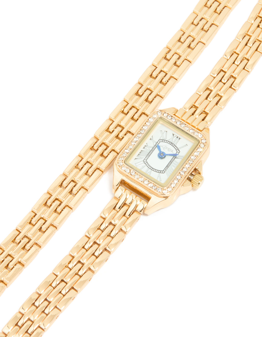 Elevate your style with this gold diamante mini double strap watch featuring a blue dial with roman numerals, rectangle shape, women's formal analog timepiece with link band watch face detail view