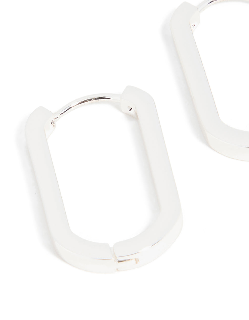 Crafted from waterproof stainless steel oblong hoop earrings in silver close up view