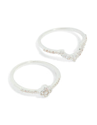 Crafted from silver plated material, these cubic zirconia dainty flower and band stacking rings in a 3-pack are highlighted close up view - link has visual effect only