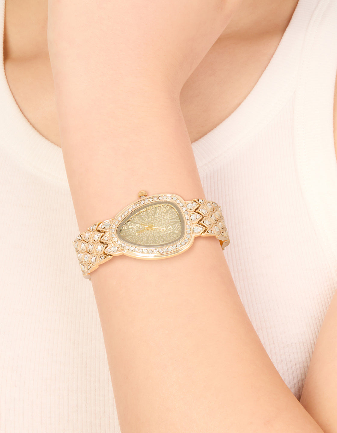 Showcasing this gold diamante statement watch features stone dial look, analog display, link band in casual styling for women on wrist view
