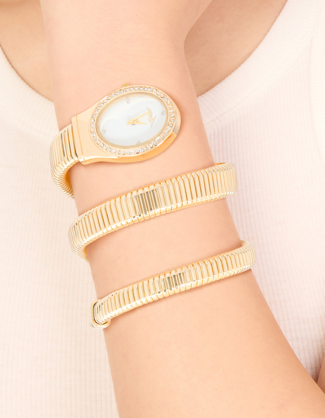Featuring a Gold Double Stretch Watch Cuff with white dial, link band, and casual styling in analog type for women on wrist view