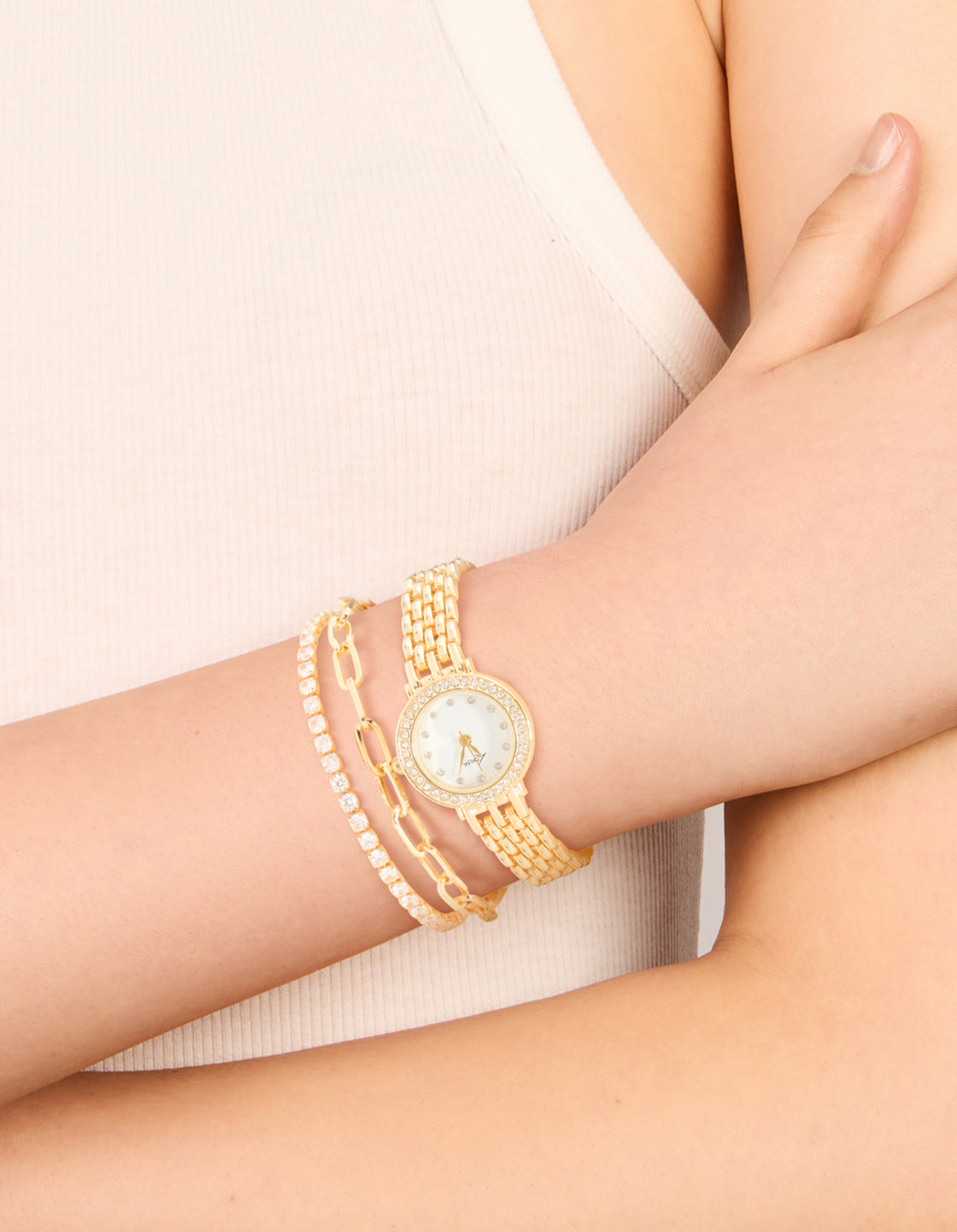 Elegant gold diamante watch and bracelets set with cubic zirconia white dial stone look round shape for women casual occasions analog link band on wrist view
