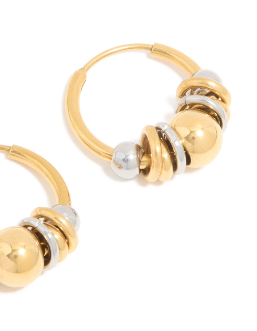 Showcasing waterproof small rondell clicker hoop earrings featuring alternating balls in gold plated stainless steel with silver accents close up view