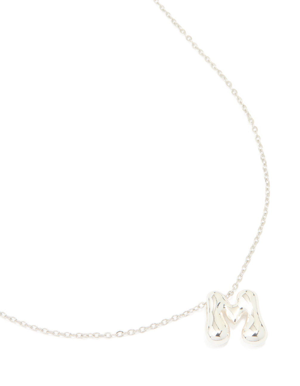 Showcasing a waterproof stainless steel dainty initial pendant necklace with large bubble letter M in silver close up view