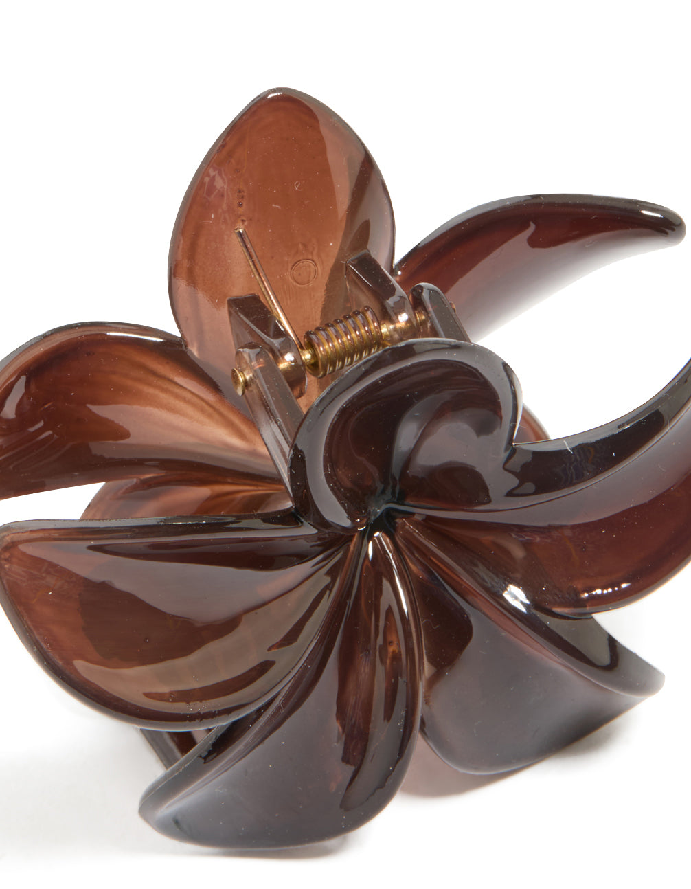 Close-up highlighting the spring clasp mechanism and interior structure of the brown solid floral claw clip in saddle brown and sienna, detail view