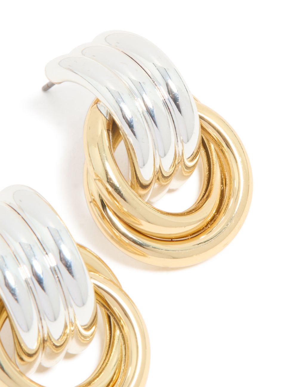 Crafted with mixed metal plated doorknocker knot earrings in gold and silver post detail view