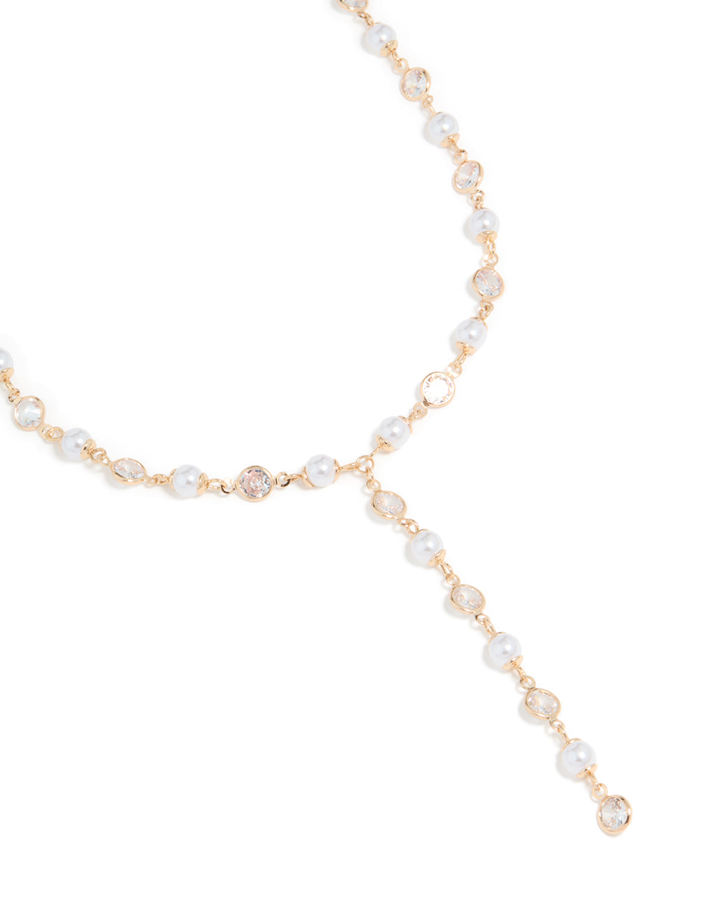 Showcasing a cubic zirconia and pearl chain Y-necklace in gold close up view