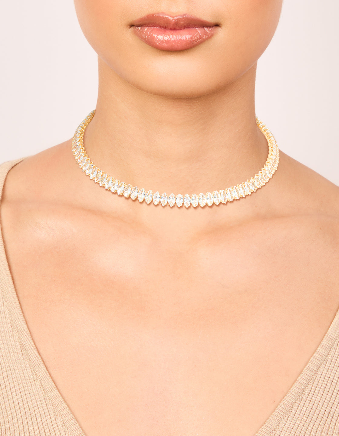 Showcasing a gold cubic zirconia choker necklace on neck view