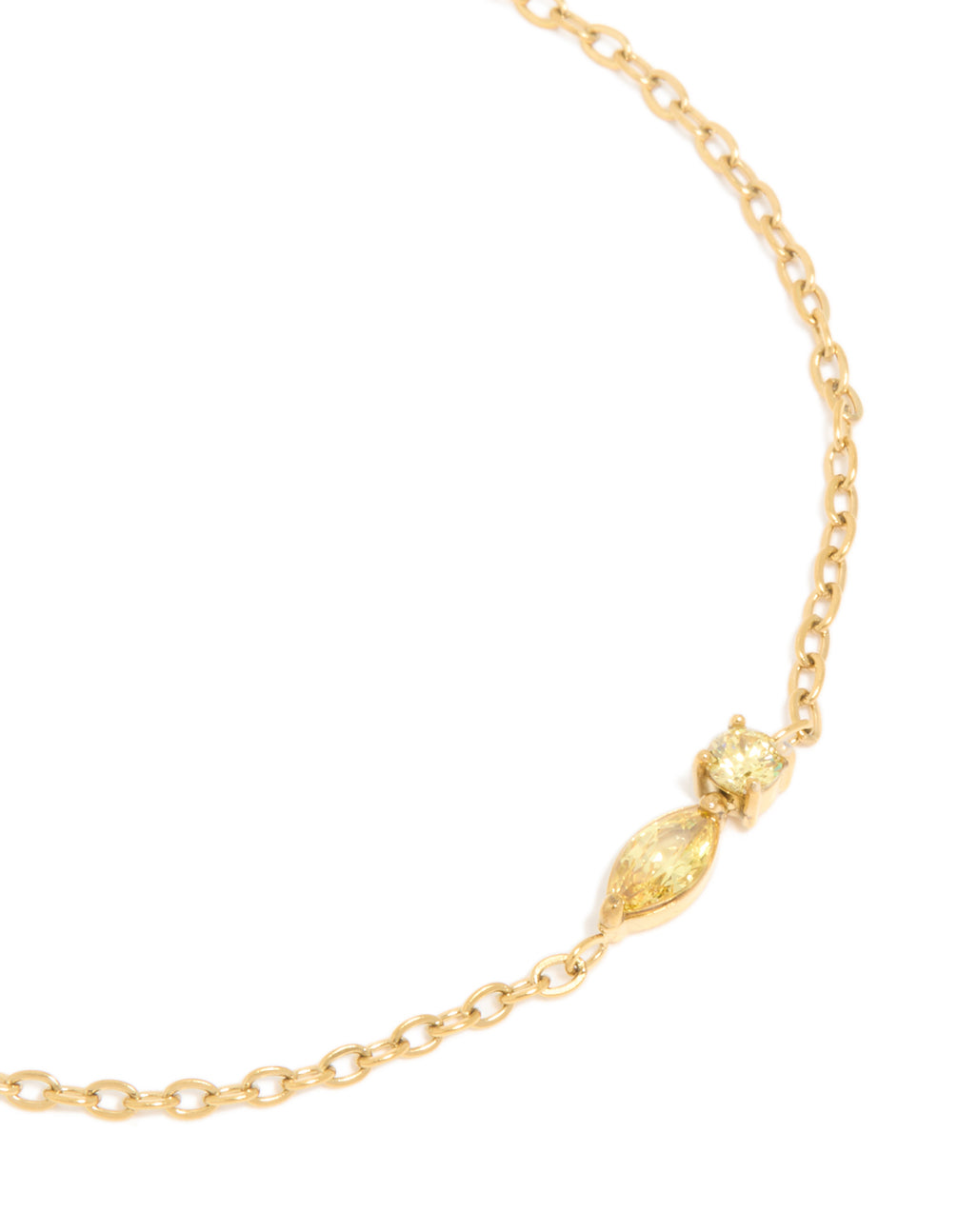 This waterproof gold plated stainless steel November birthstone bracelet highlights cubic zirconia with marquise and round cut yellow stones close up view