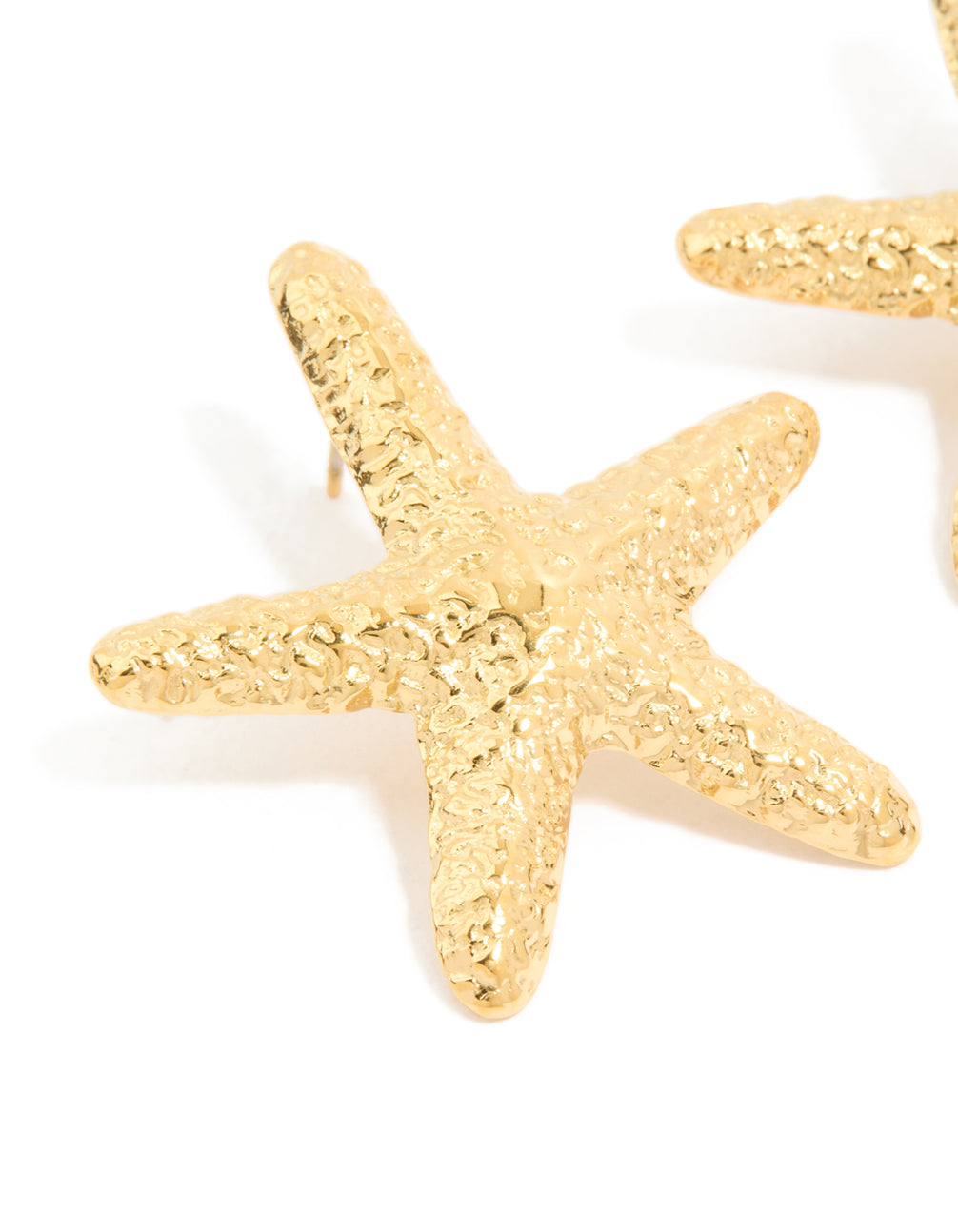 Detailed texture and craftsmanship of waterproof gold plated stainless steel statement starfish stud earrings with ocean close up view