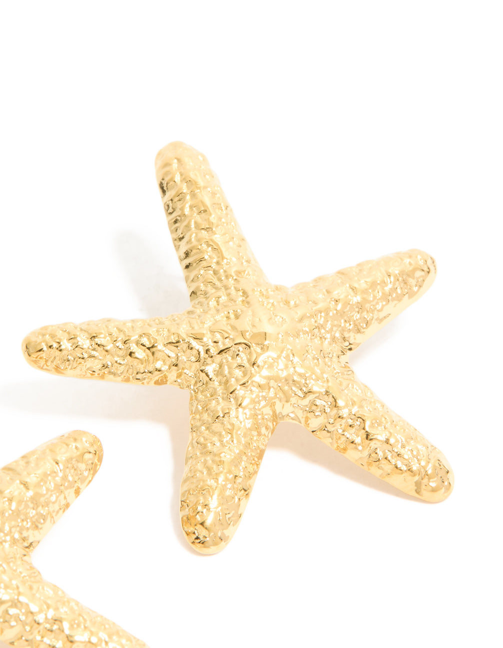 Examining waterproof gold plated stainless steel statement starfish stud earrings with ocean highlighting textured surface post detail view