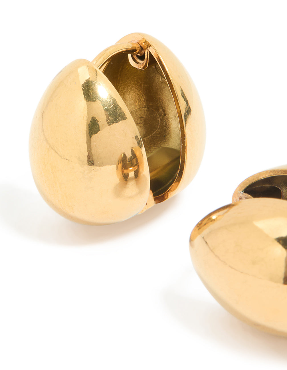 Designed with waterproof gold plated stainless steel chunky pebble huggie earrings close up view