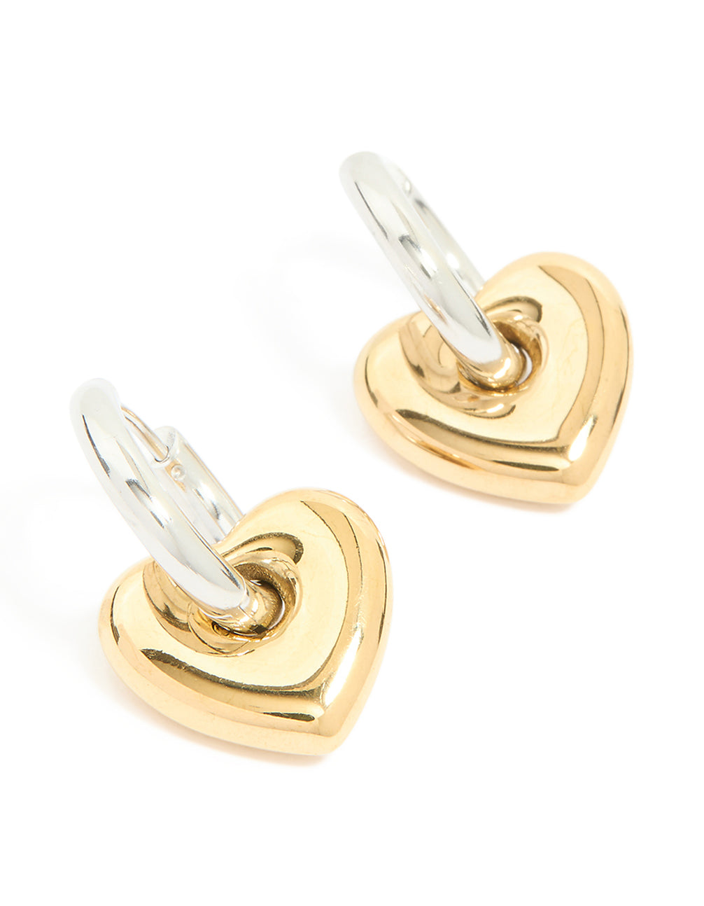 Showcasing waterproof mixed metal plated small heart huggie earrings in stainless steel with gold and silver tones front view
