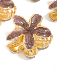 Crafted with floral detailing on small brown frangipani claw clips in gold detail view - link has visual effect only