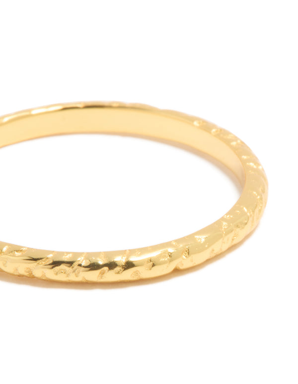 Showcasing gold plated sterling silver molten ring with textured band close up view