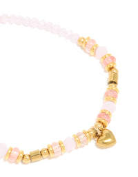 Explore waterproof gold plated stainless steel rose quartz semi precious mini heart bracelet crafted with beads, charm, and dainty details close up view - link has visual effect only