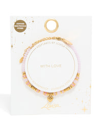 Explore waterproof gold plated stainless steel rose quartz semi precious mini heart bracelet crafted with beads, charm, and dainty details close up view - link has visual effect only
