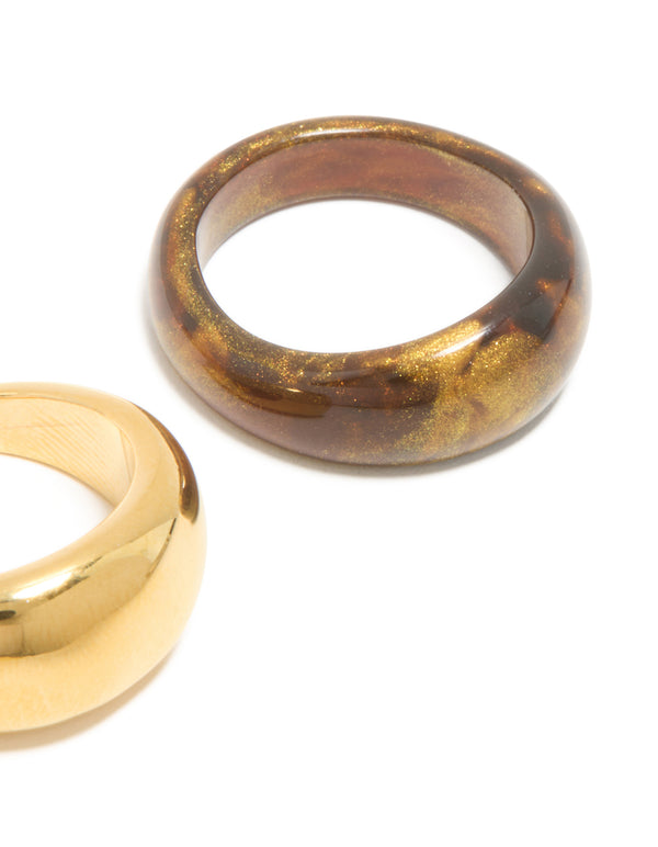 Designed with waterproof gold plated stainless steel and brown modern stacking rings in a 2-pack featuring chunky design and glitter side detail view