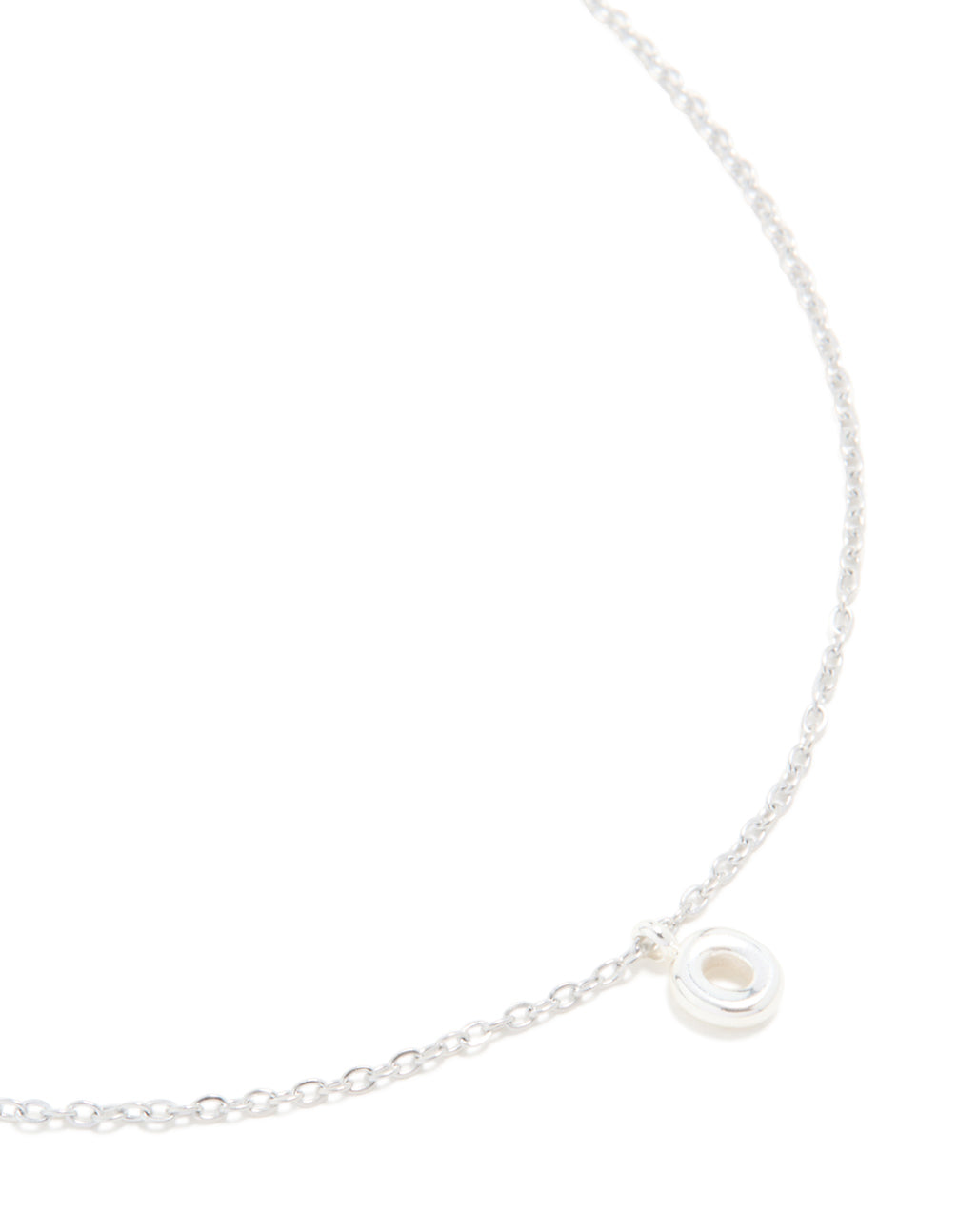 Showcasing a waterproof stainless steel mini bubble letter O necklace with initial pendant in dainty silver close up view