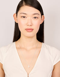 Presenting a waterproof stainless steel mini bubble letter O necklace with initial pendant in dainty silver on model view - link has visual effect only