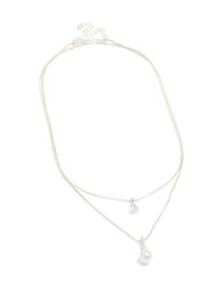 Featuring a silver plated double layered cubic zirconia and pearl necklace front view - link has visual effect only