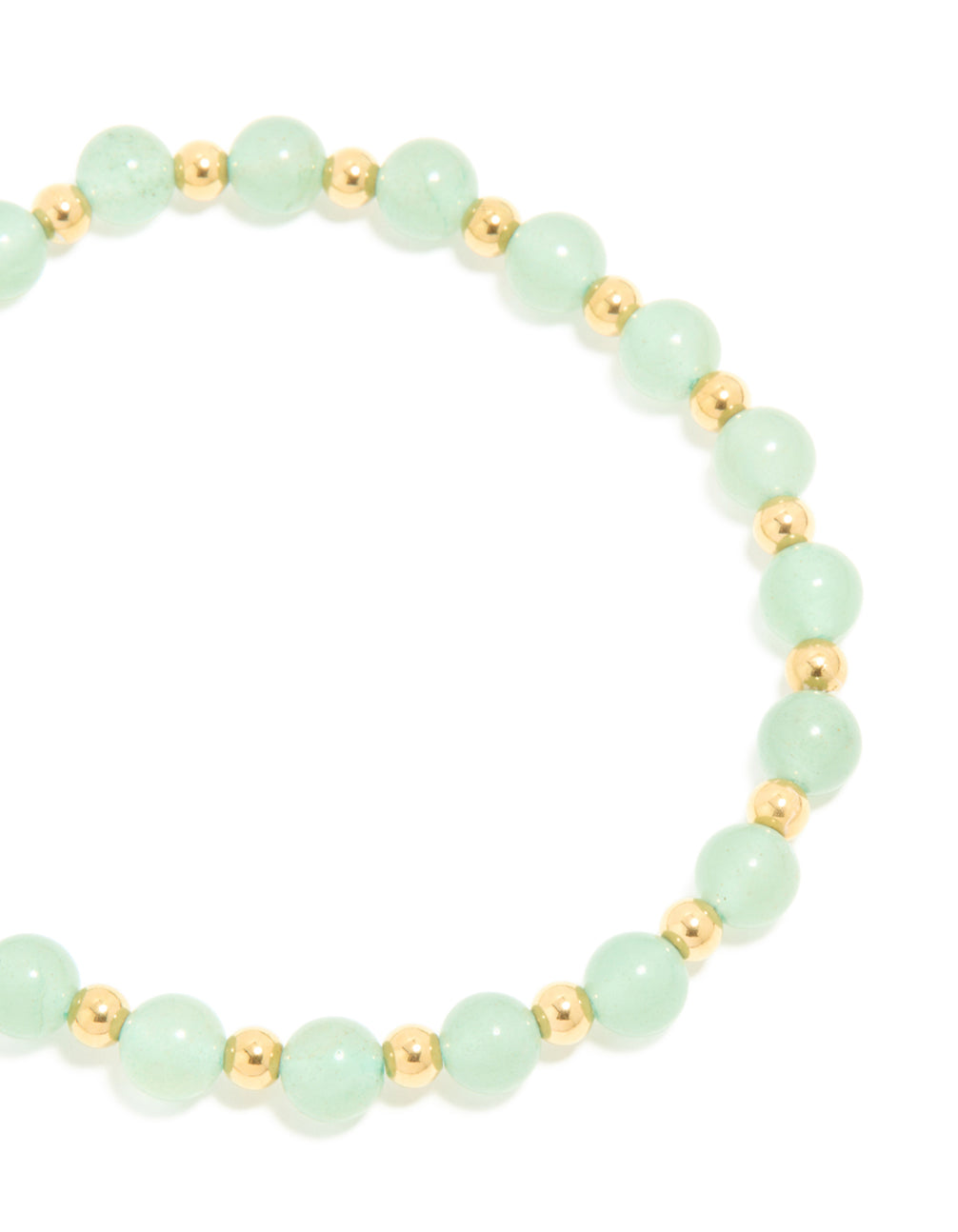 Highlighting a waterproof beaded stretch bracelet crafted from gold plated stainless steel with pale green beads close up view