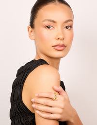 Showcasing a waterproof triple layered twist moving dainty ring in gold plated stainless steel on finger view - link has visual effect only