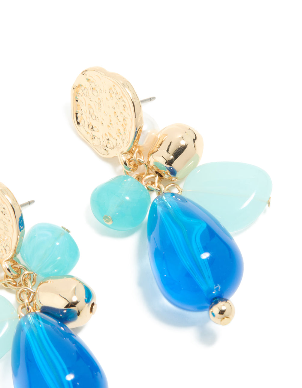 Highlighting gold textured and blue beaded drop earrings with coin in statement style post detail view