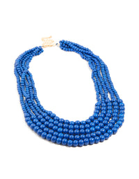 Discover this dark blue acrylic beaded long layered necklace with royal statement gold accents front view - link has visual effect only