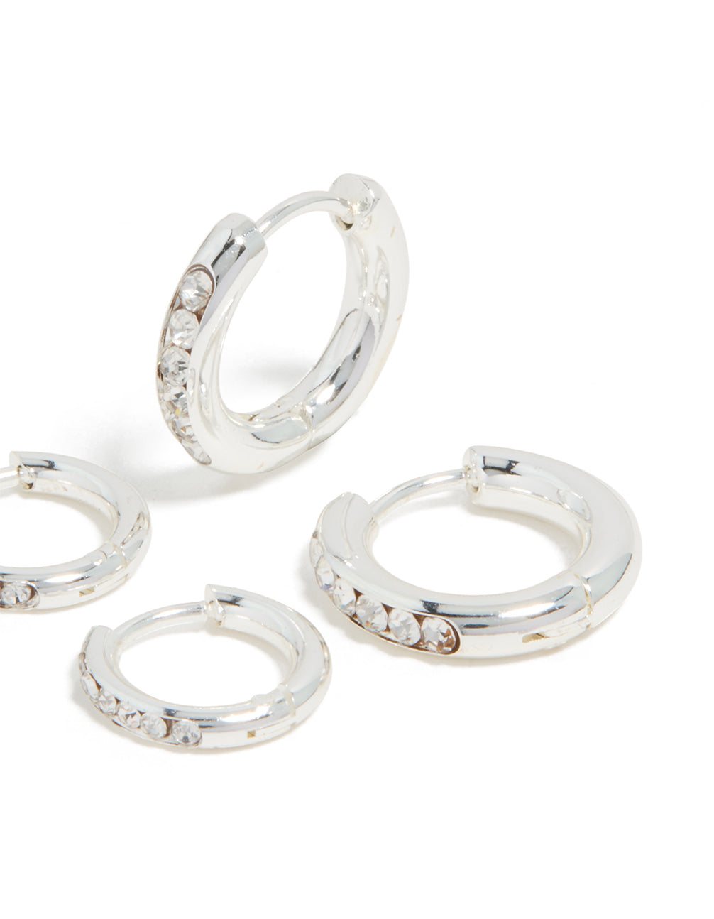 Designed with waterproof stainless steel and cubic zirconia, these huggie earrings in silver 2-pack are shown in post detail view