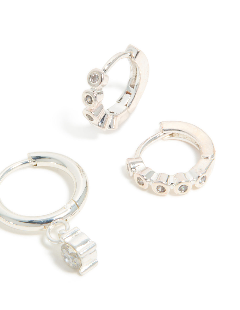 Featuring waterproof stainless steel bezel diamante and plain huggie earrings 2-pack with charm in silver and white post detail