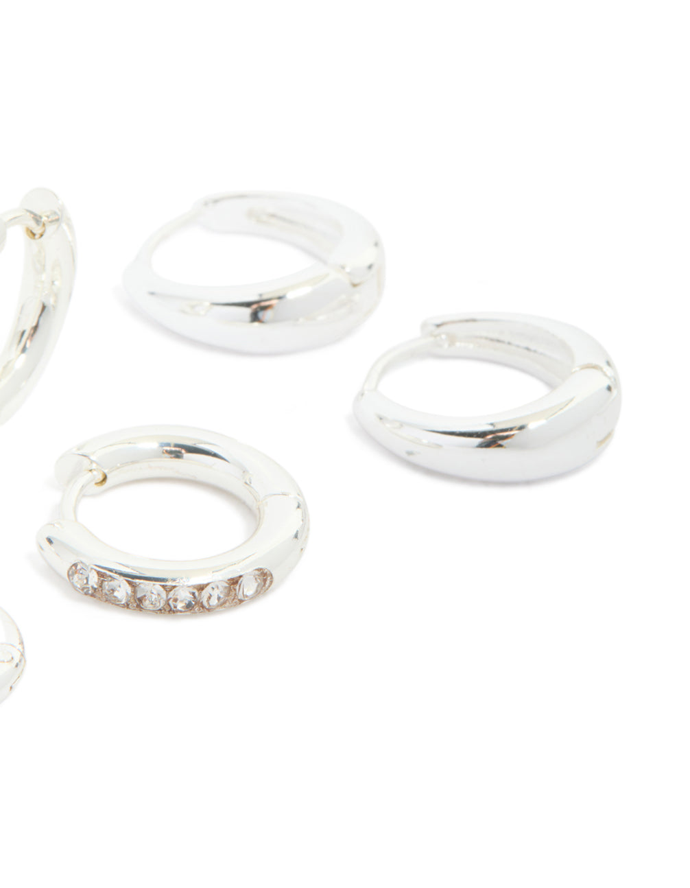 Featuring waterproof stainless steel basic, pavé and plain huggie earrings with cubic zirconia in silver 3-pack post detail view