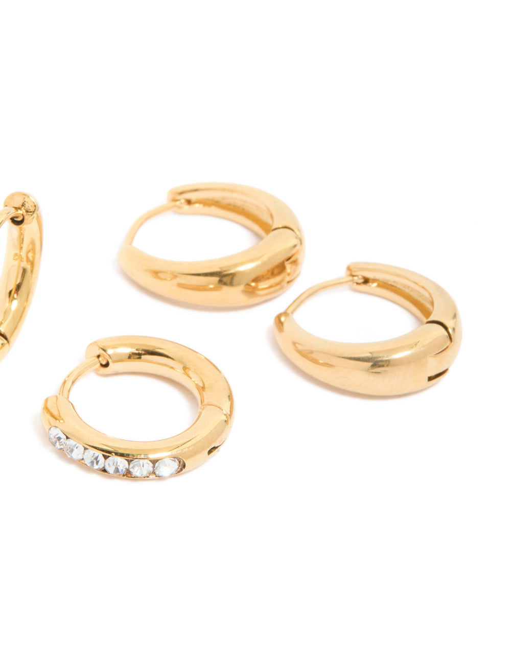 Featuring waterproof stainless steel construction, these pavé and plain huggies with gold plating come in a 3-pack with a post detail view