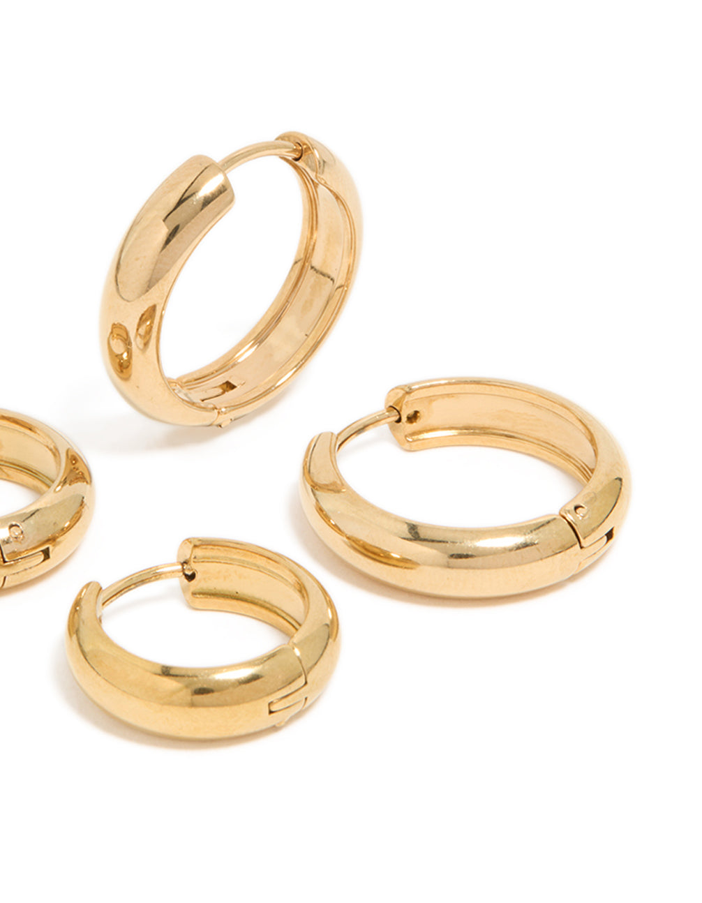 Highlighting these waterproof gold plated stainless steel thick huggie earrings in a 2-pack with chunky styling in a post detail view