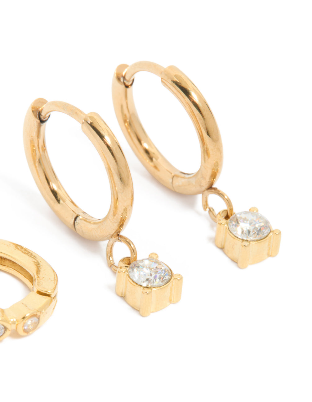 Explore waterproof bezel diamante huggie earrings in a 2-pack, designed with stainless steel and gold plating in a post detail view