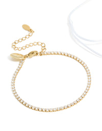 Beautiful waterproof gold plated stainless steel bracelet set with oval cut cubic zirconia tennis and white cord close up view - link has visual effect only